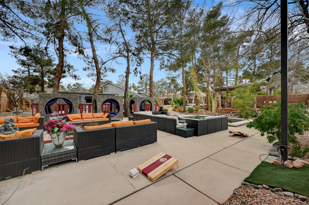 Zen Oasis villa has a spacious background with cozy outdoor seating and games for guests to enjoy in their private Vegas space.